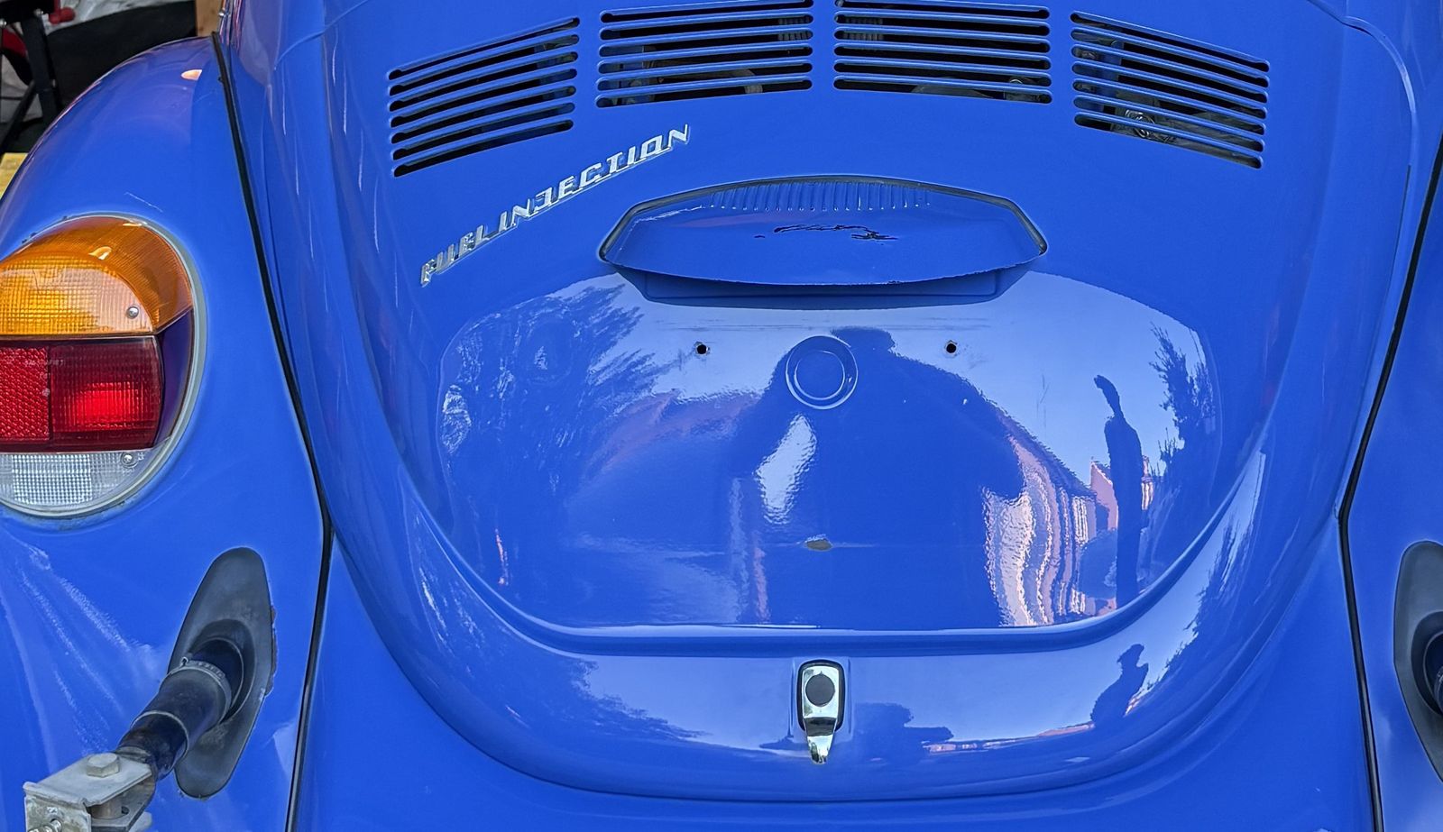 The Fuel Injection badge and engine-lid vents in cornflower blue